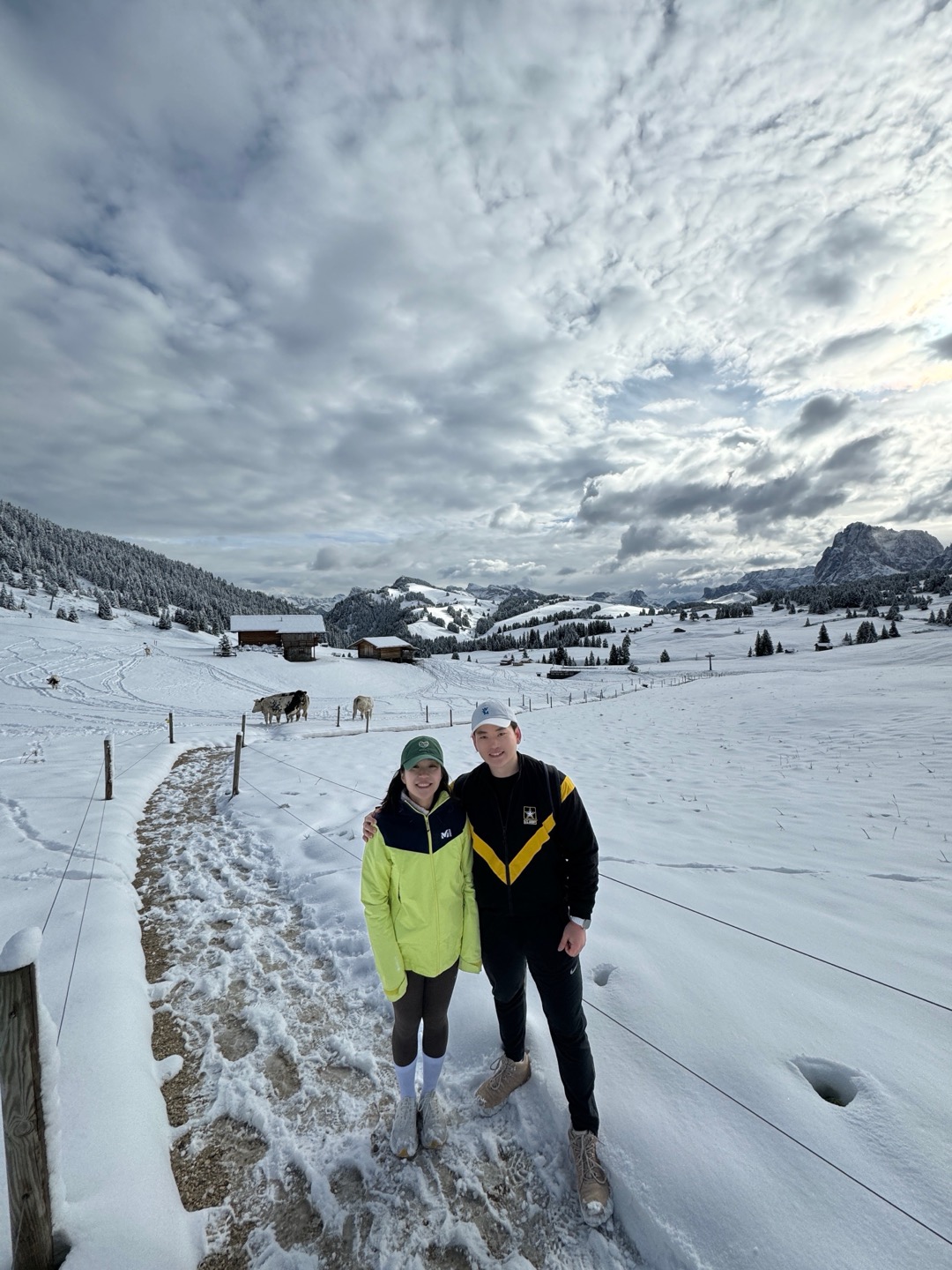Jex and Hanna standing together on a snowy mountain path.